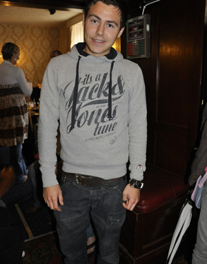Street style contestant in a Jack & Jones grey hoodie and jeans