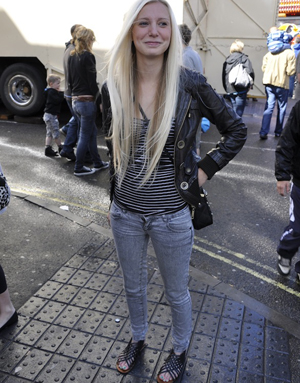 Street style contestant in a nautical striped top, snow wash skinny jeans and a leather jacket