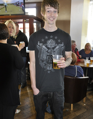 Street style contestant in a FLY53 t-shirt and jeans